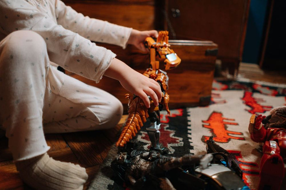 A child building a dragon model
