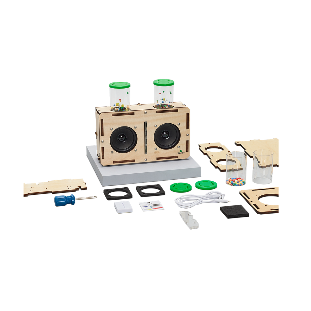 KiwiCo Kinetic Light-Up Speaker, speaker with parts laid out