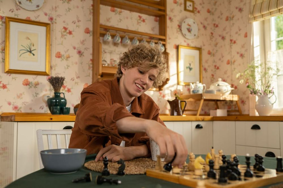 A collector setting up a chess set